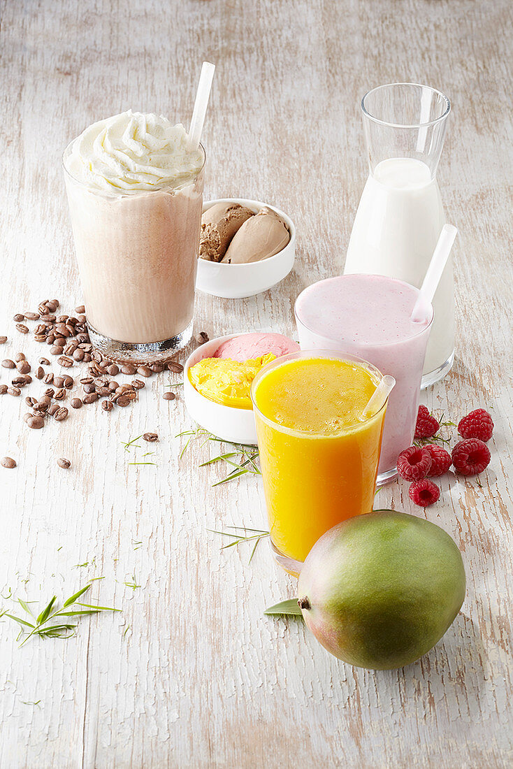 A coffee milkshake, a strawberry milkshake and a mango slush