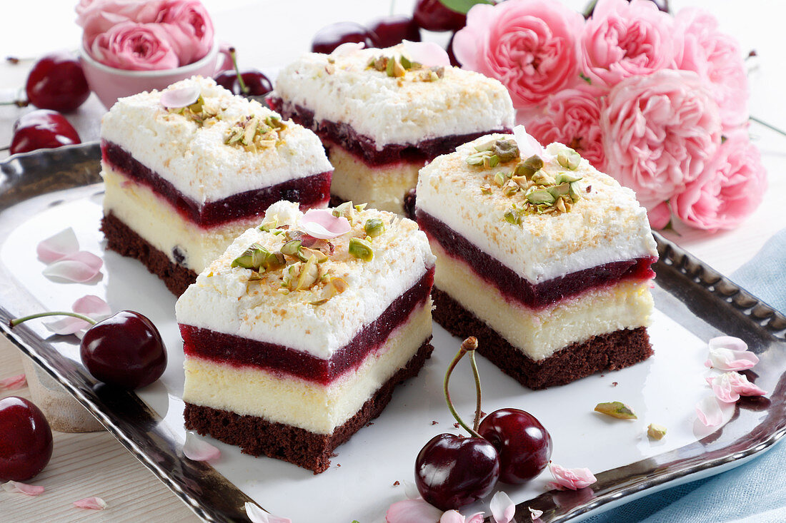Chocolate-vanilla cake with cherries and cream