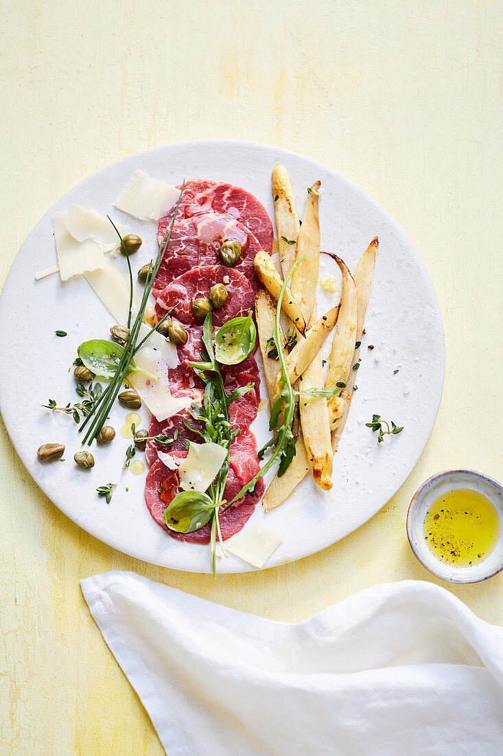 Beef carpaccio with roasted white asparagus and rocket