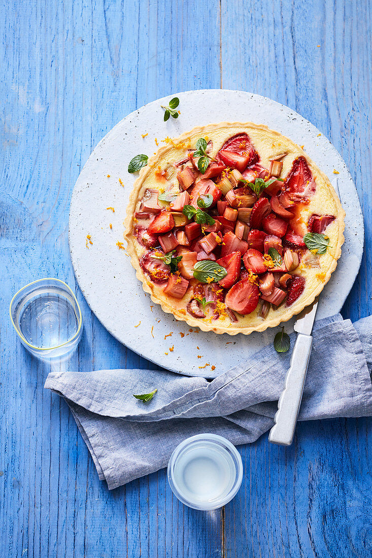 Custard tart with strawberries and rhubarb