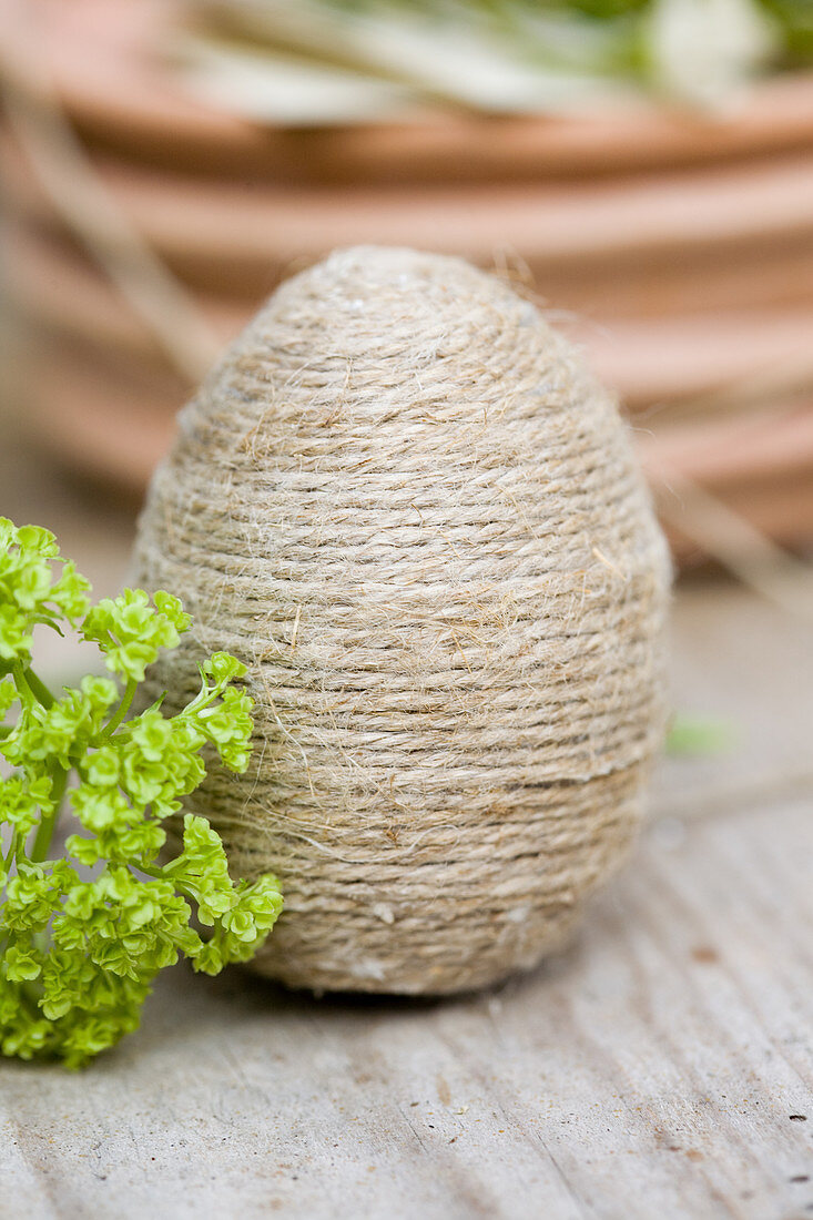 Egg covered in twine as Easter decoration