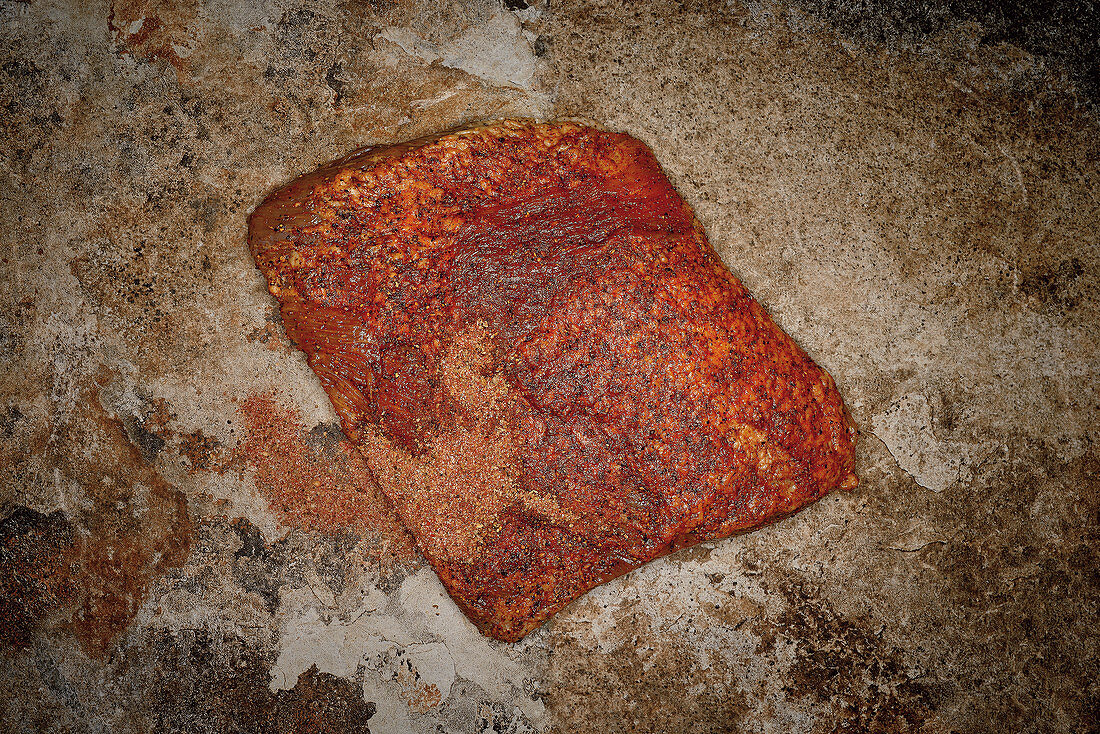 Raw beef brisket with jerk spice mix