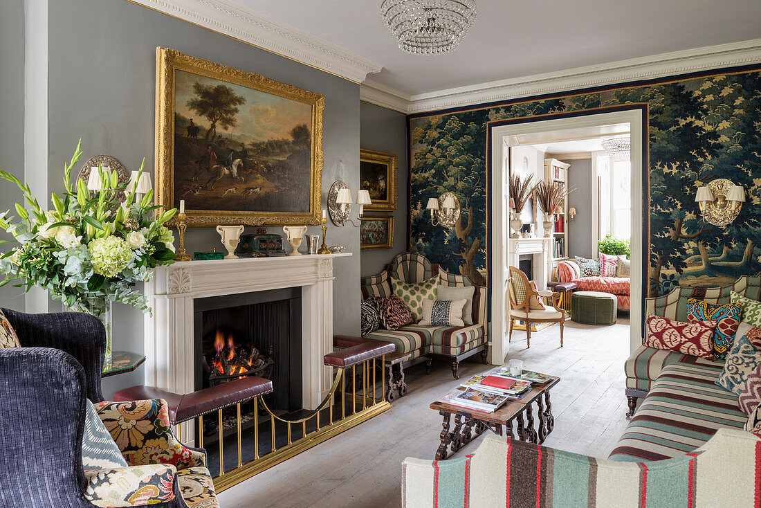 Open fireplace with fender seat in English-style living room