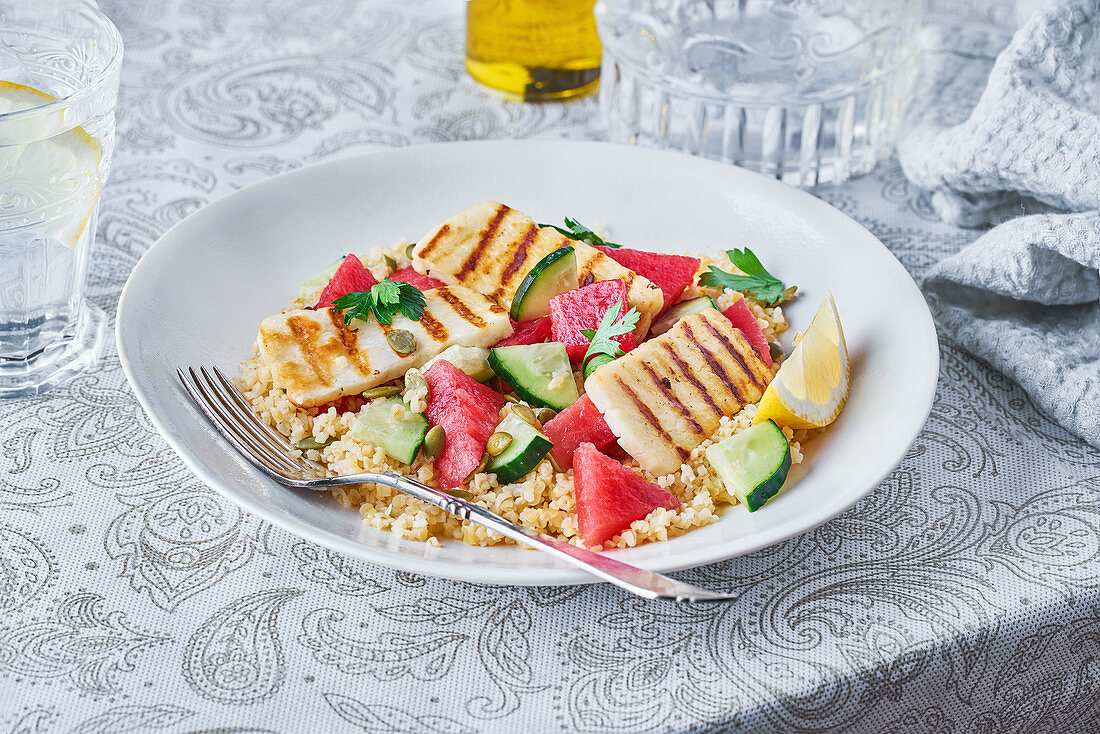 Appetizing Bulgur salad with watermelon and cucumbers