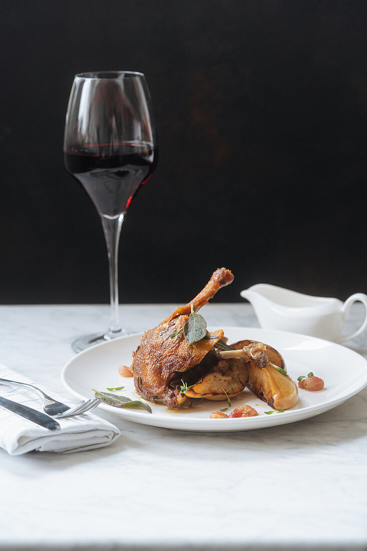Roasted quail and glass of red wine