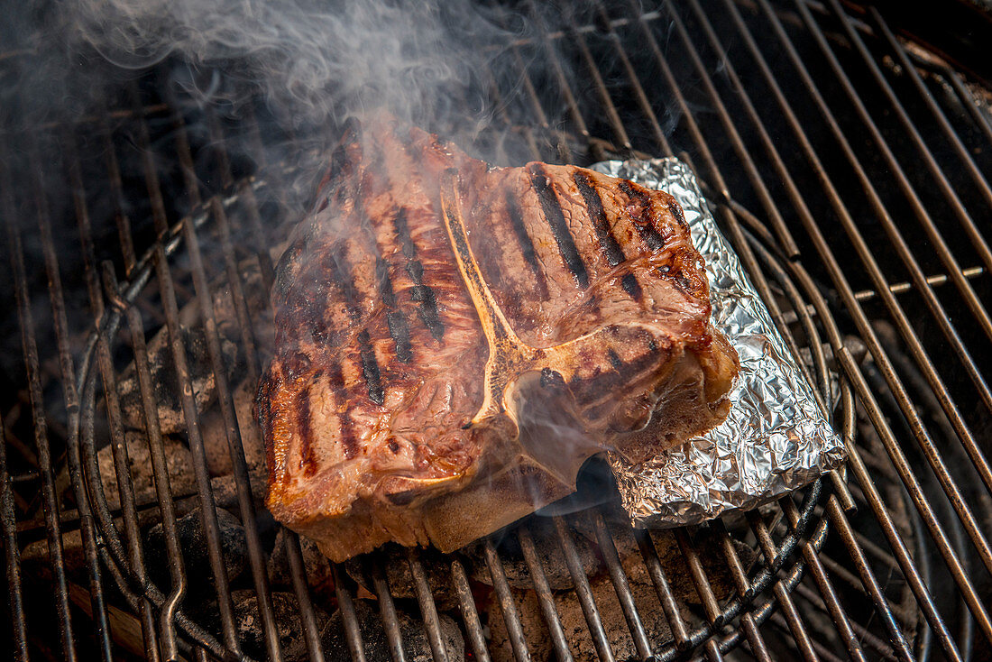 Porterhouse steak on a grill rack