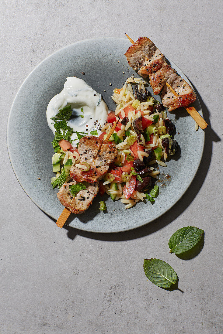 Gyros skewers with a rice noodle salad