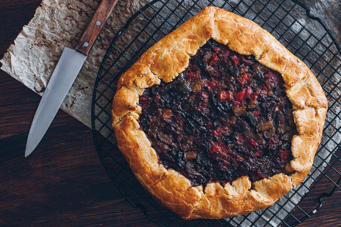 Vegetable galette arranged on wooden table