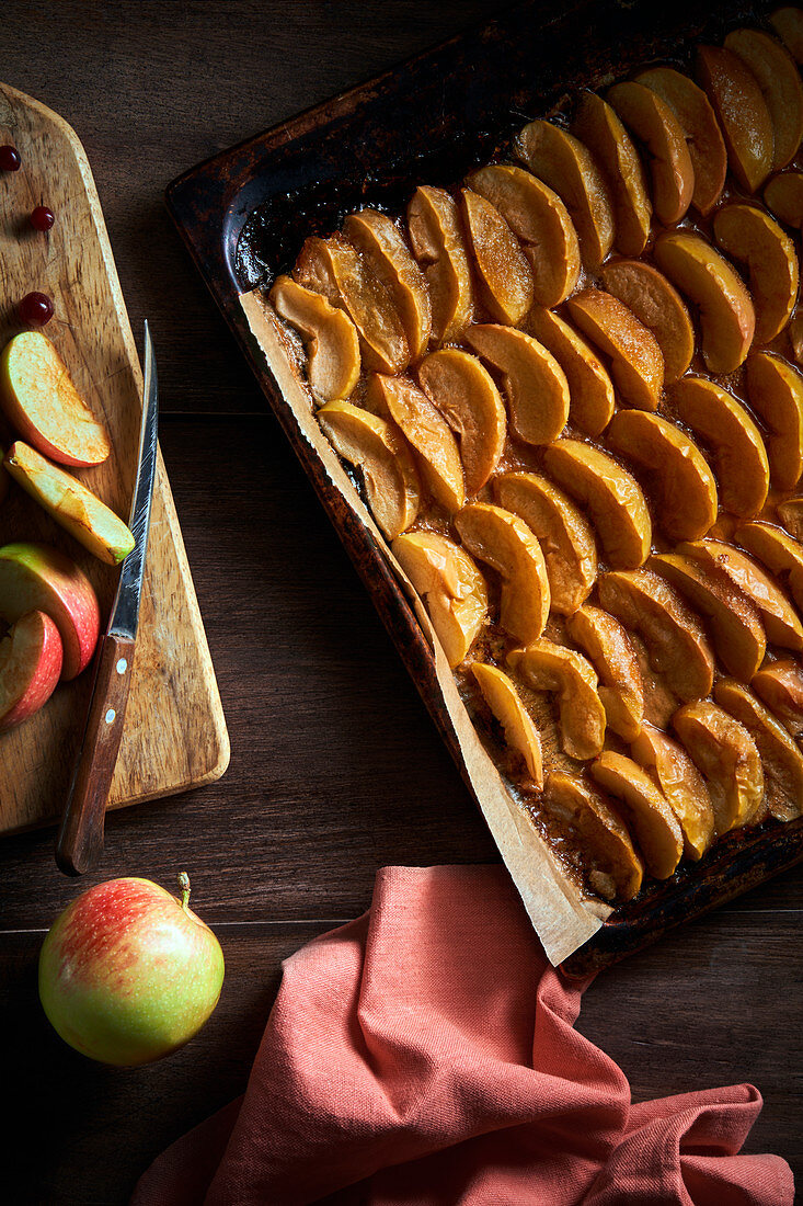 Sliced baked apples on baking tray