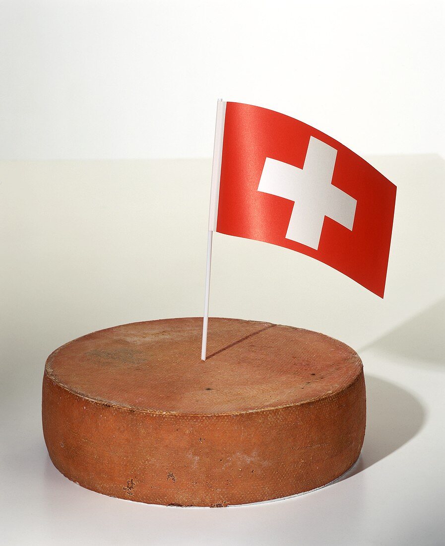 A Wheel of Appenzeller with Swiss Flag