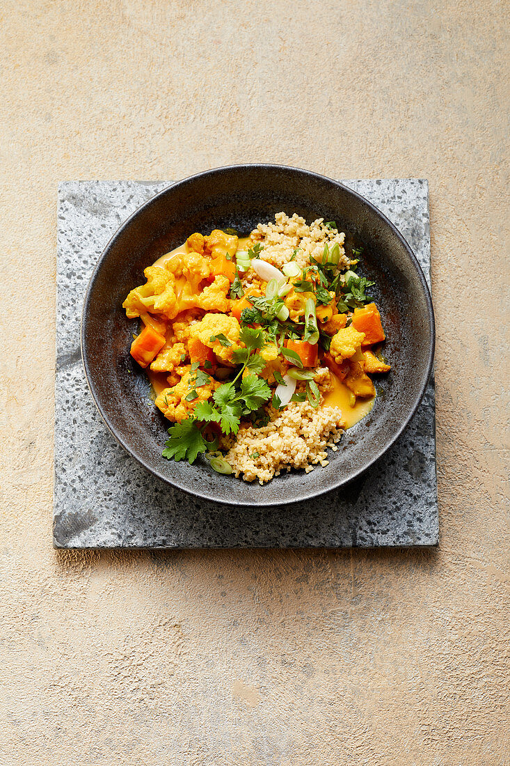 Vegan 'butter' curry with cauliflower and millet