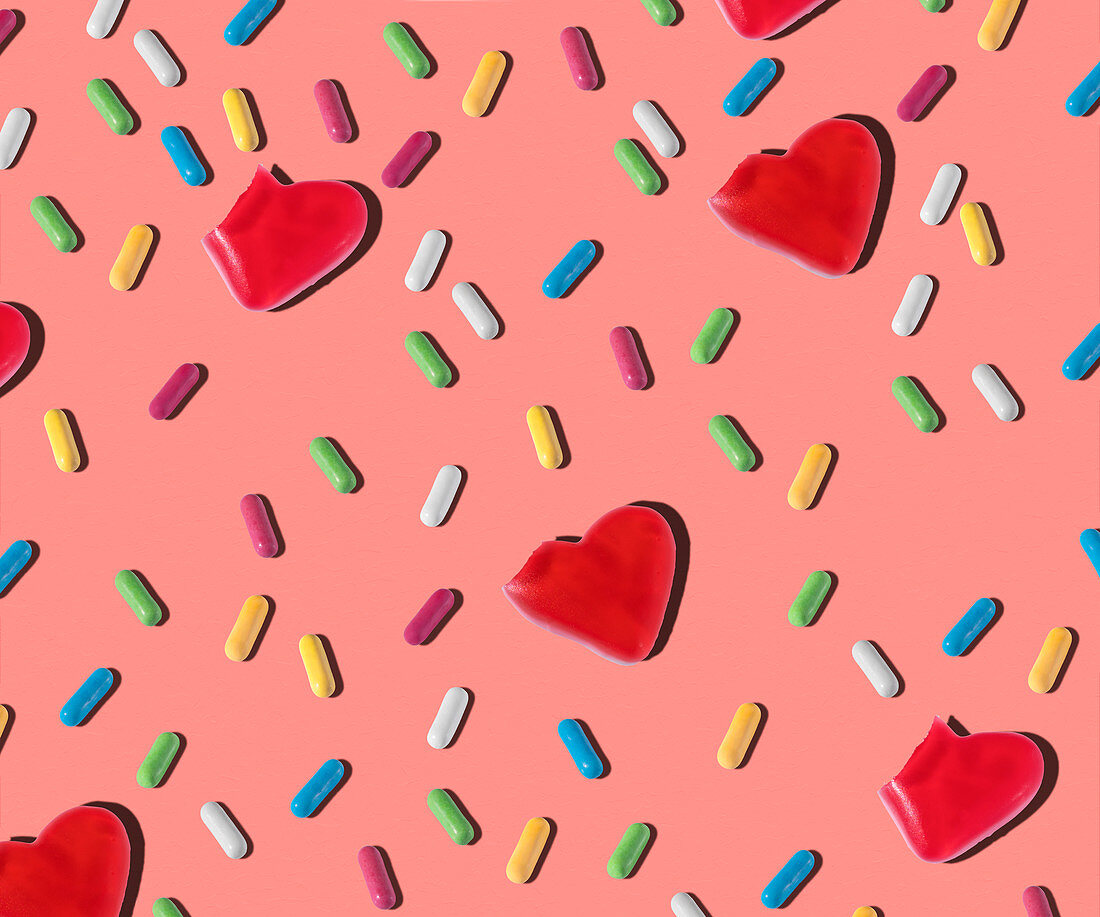 Pattern of heart shaped and colorful small jelly candies