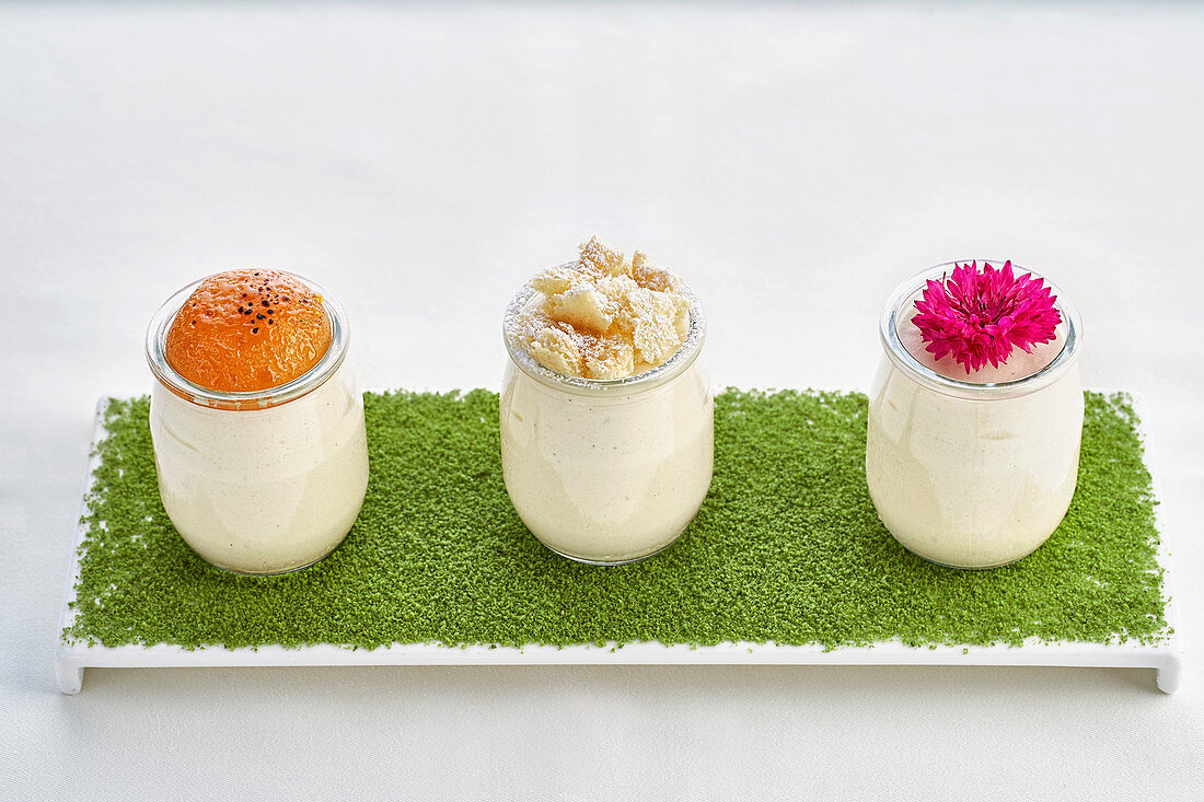 A trio of desserts in glasses