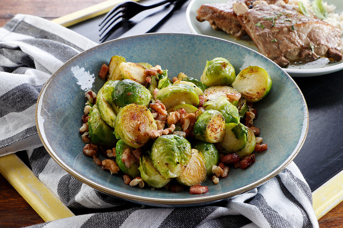 Brussels sprouts fried with bacon and nuts