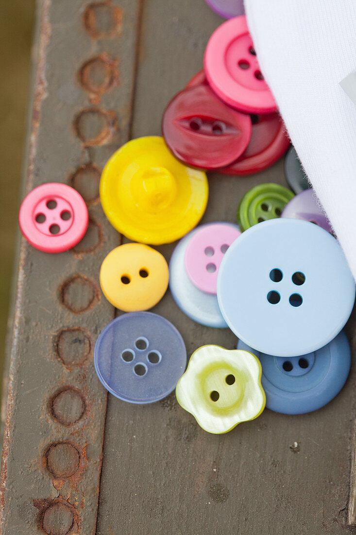Colorful buttons on an old crate