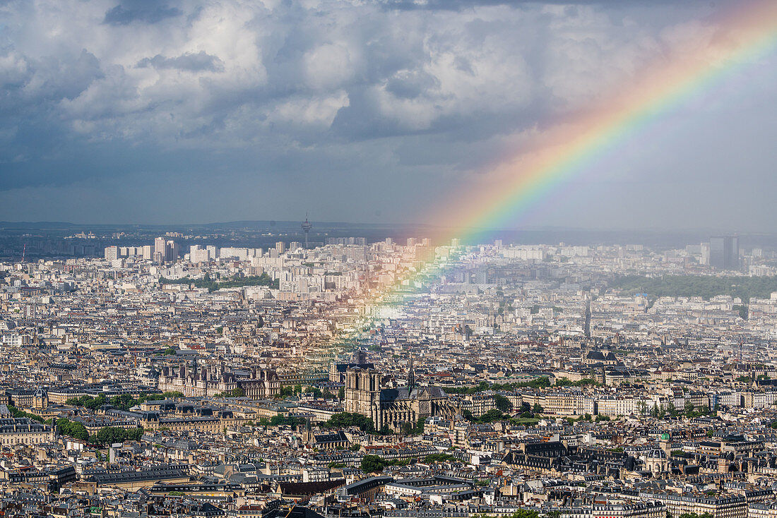 Notre Dame de Paris cathedral under a rainbow