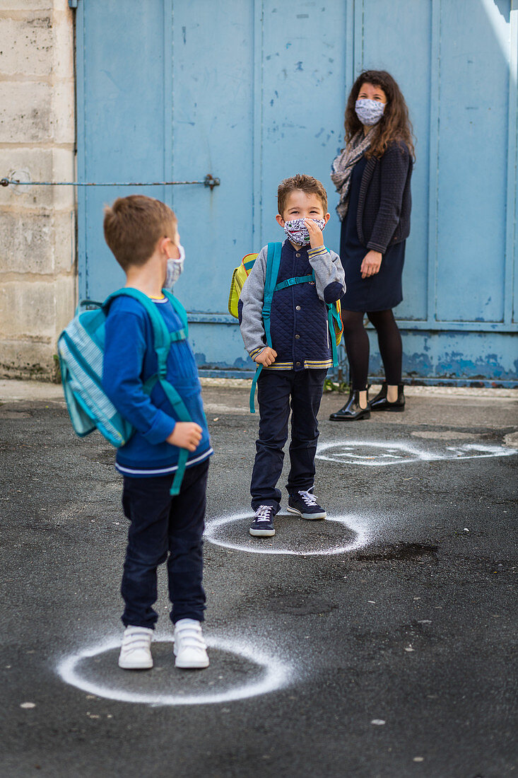 Social distancing mark on the ground in a school