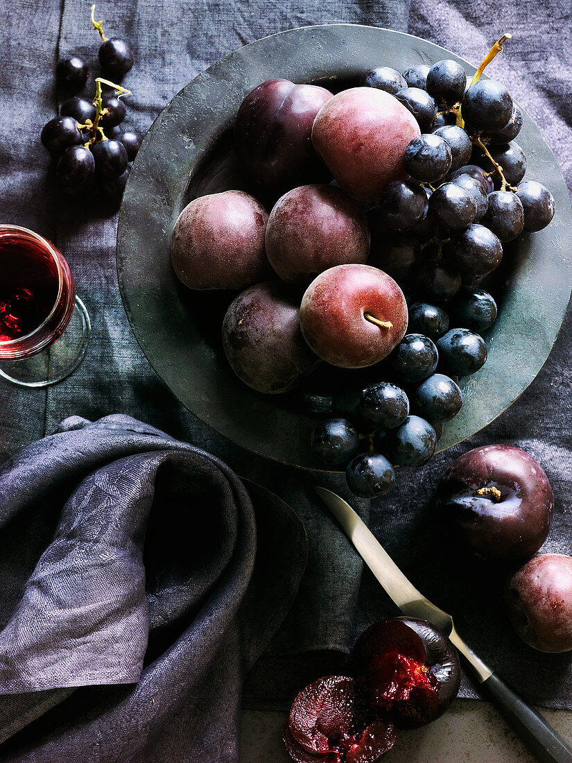 Purple fruit sill - black grapes and plums