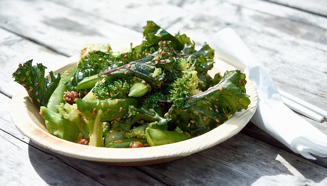 Broccoli salad with pea pods, kale and nuts