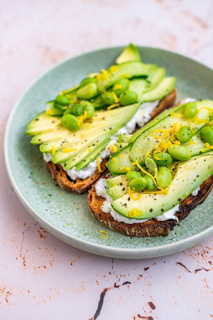 Sliced Avocado on Toast with Labneh, Lemon, Edamame and Cucumber