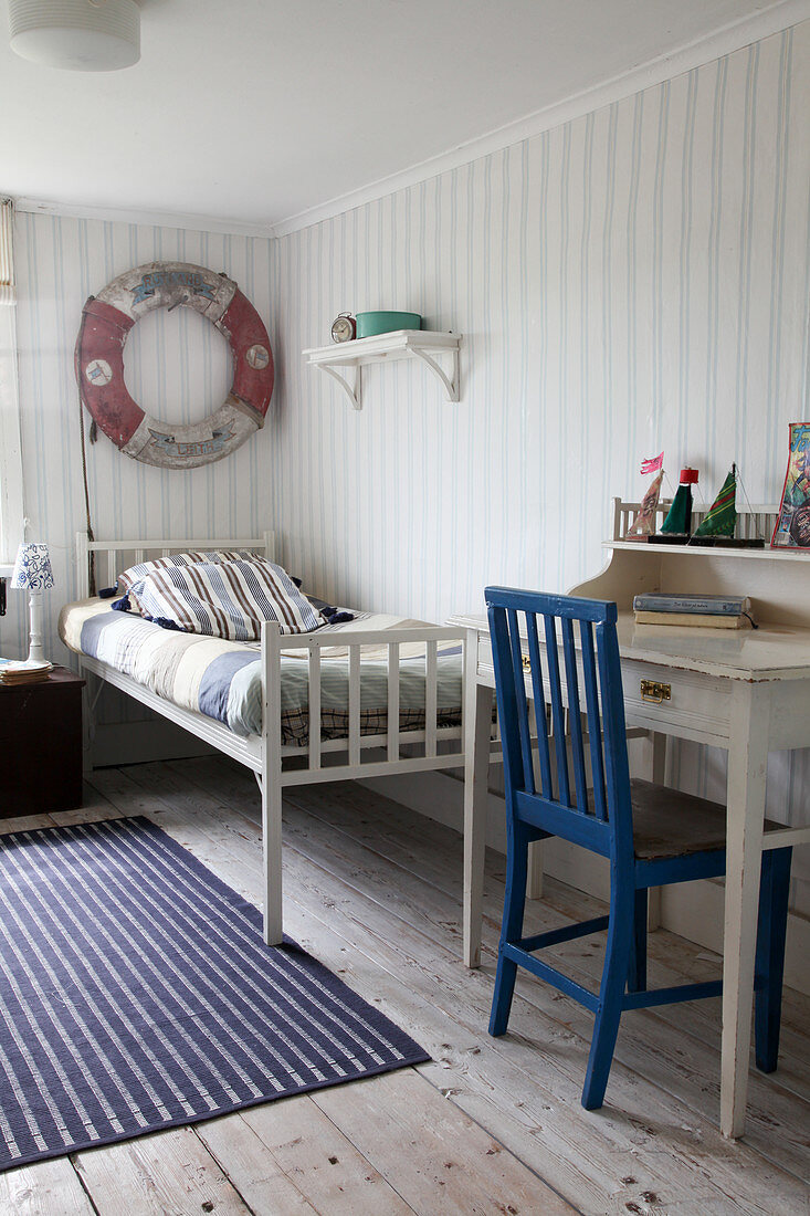Various striped patters in maritime, vintage-style boy's bedroom