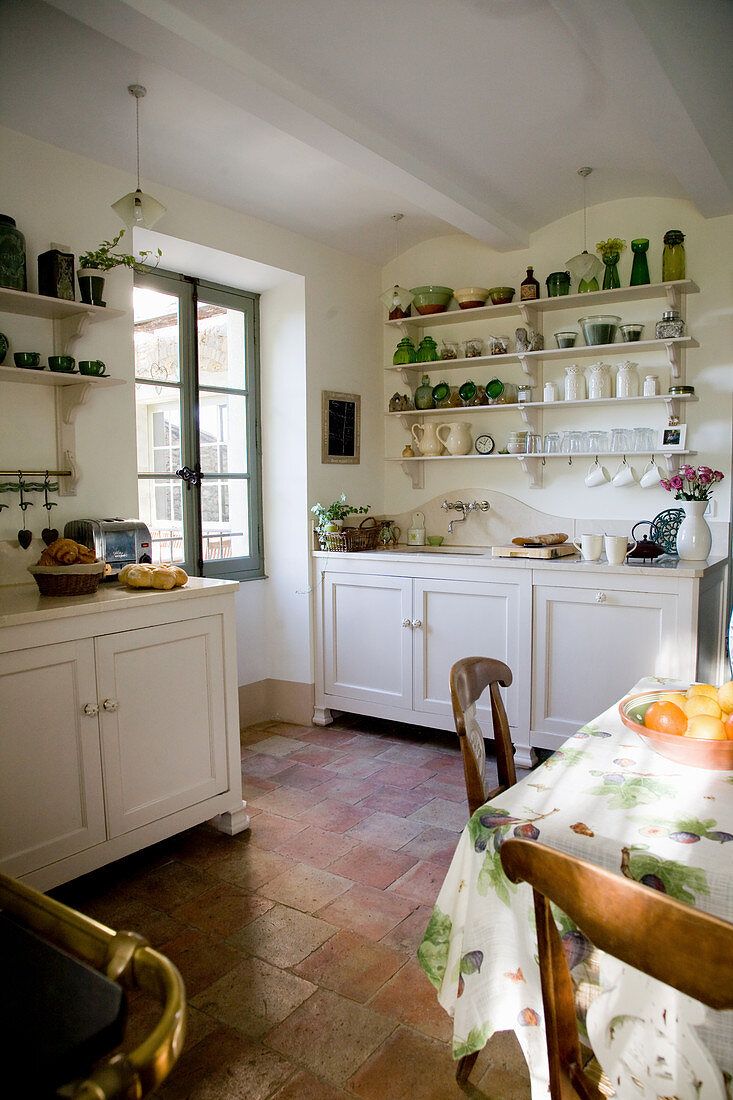 French-style country kitchen with terracotta tiled floor