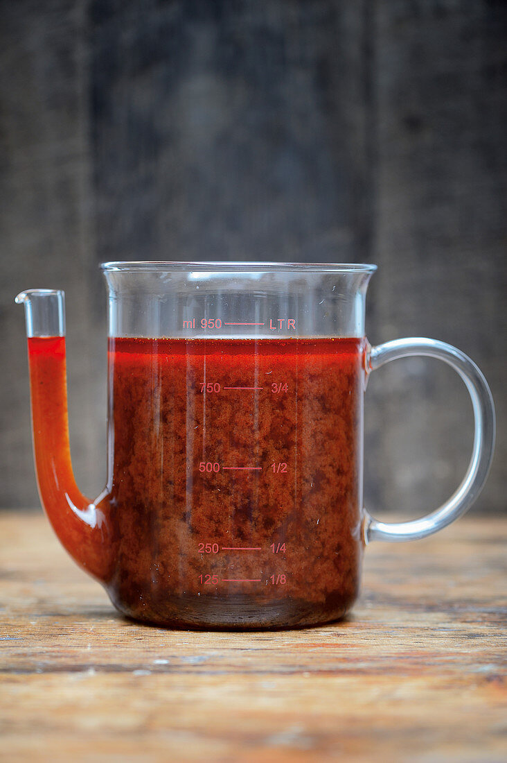 Game broth in a glass jug