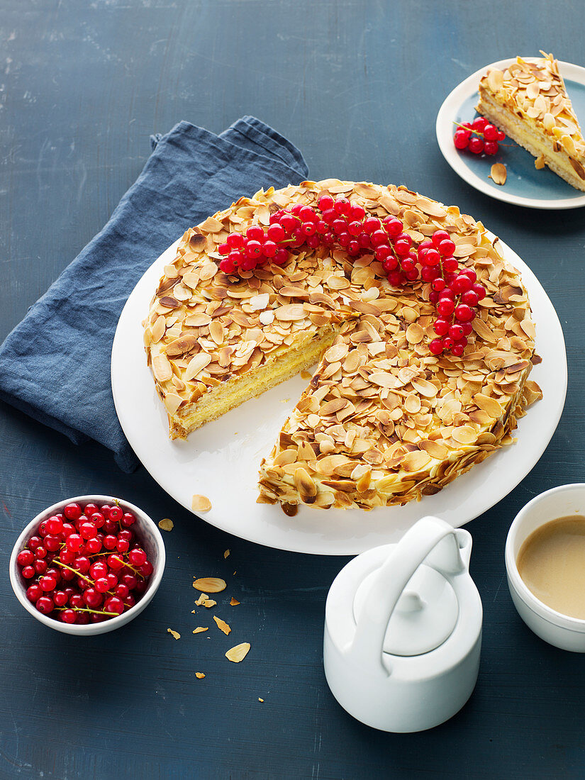 Swedish almond cake with redcurrants, sliced