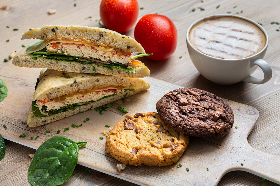 Focaccia of chicken and veggies, cookies and cappuccino