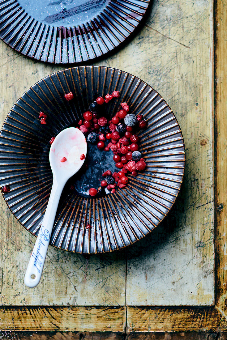 The remains of frozen berries in a bowl