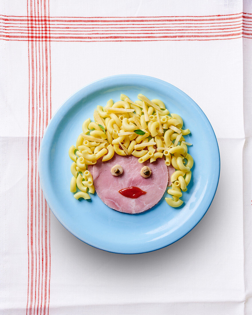 A ham face with pasta hair
