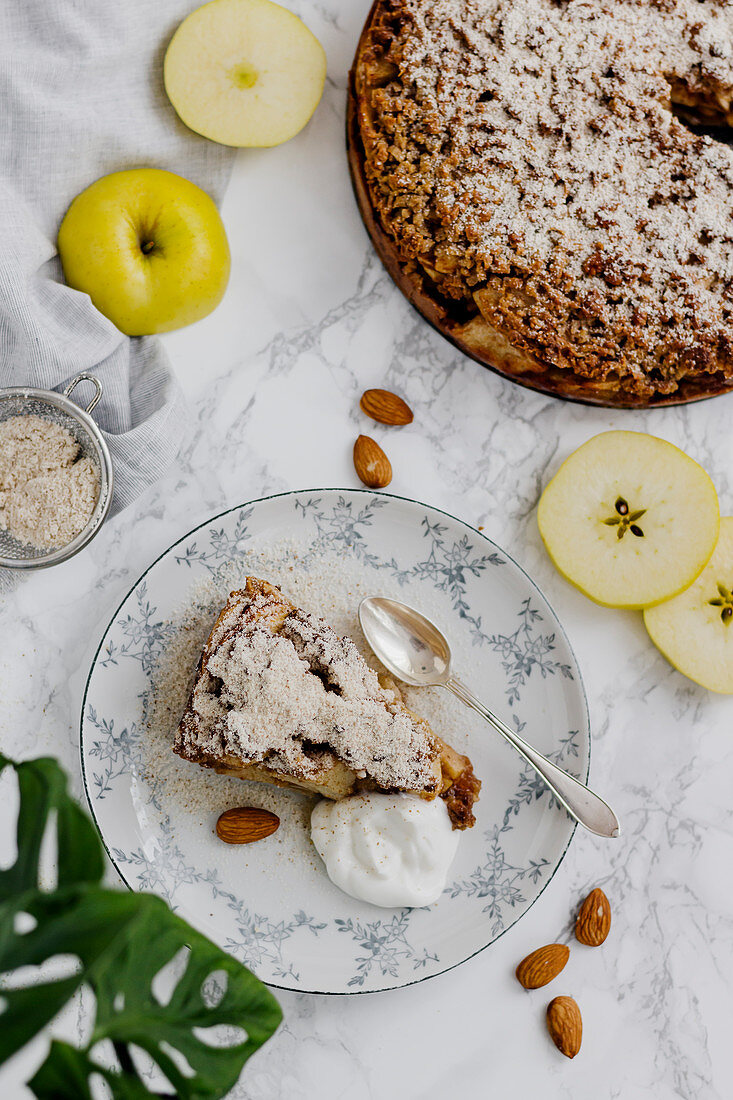 Apple cake with almond crumbles and cream