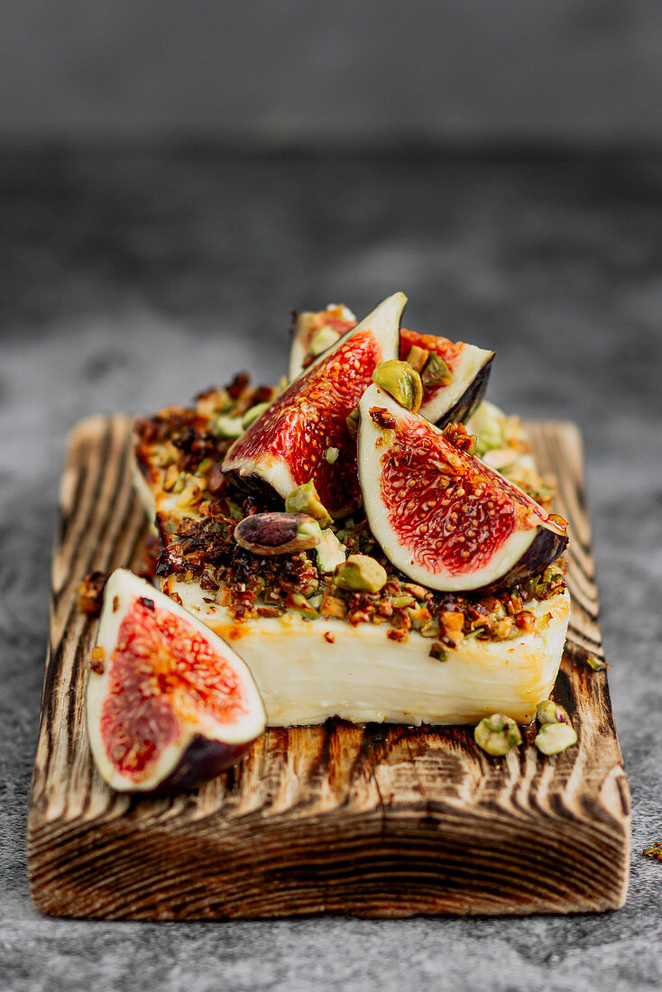 Baked feta cheese with pistachios, honey and figs