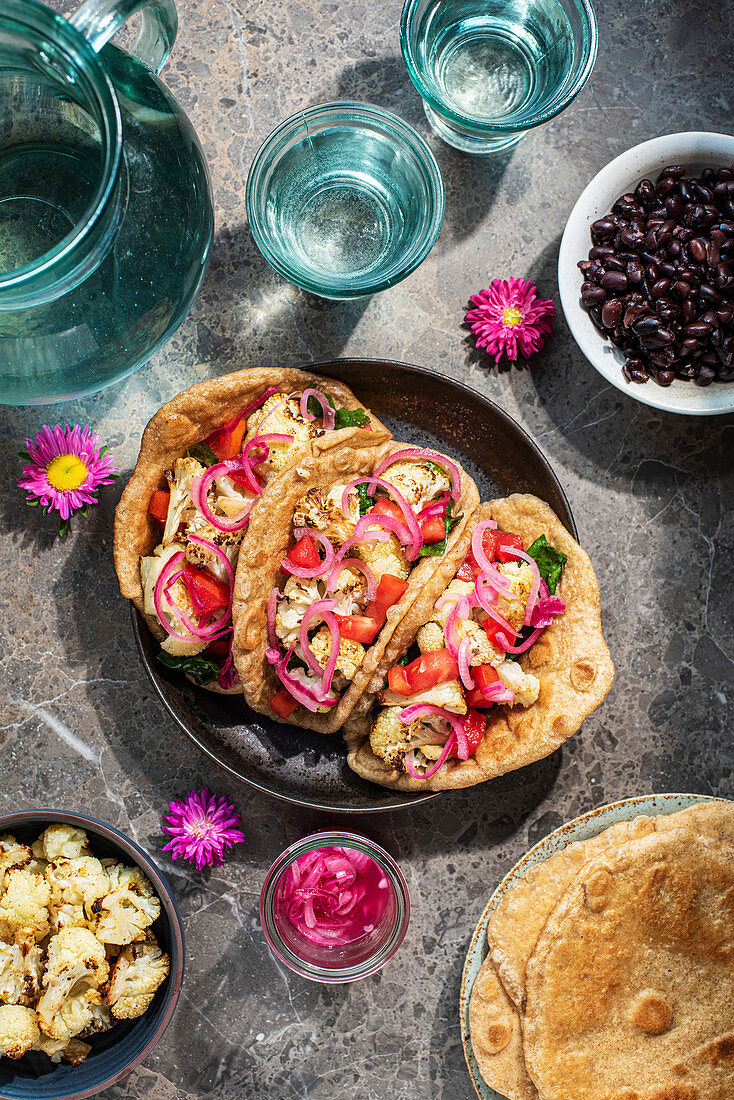 Vegeterian tortillas with cauliflower and pickled onions