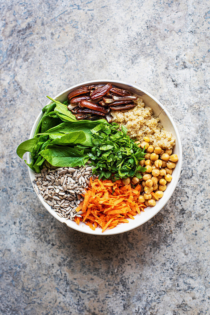 Gluten-free salad bowl with quinoa and raisins