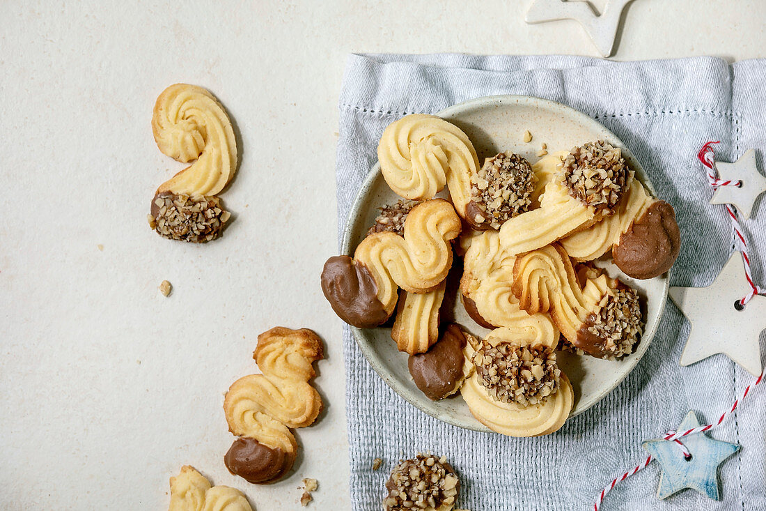 Shortcrust cookies with chocolate glaze and nuts