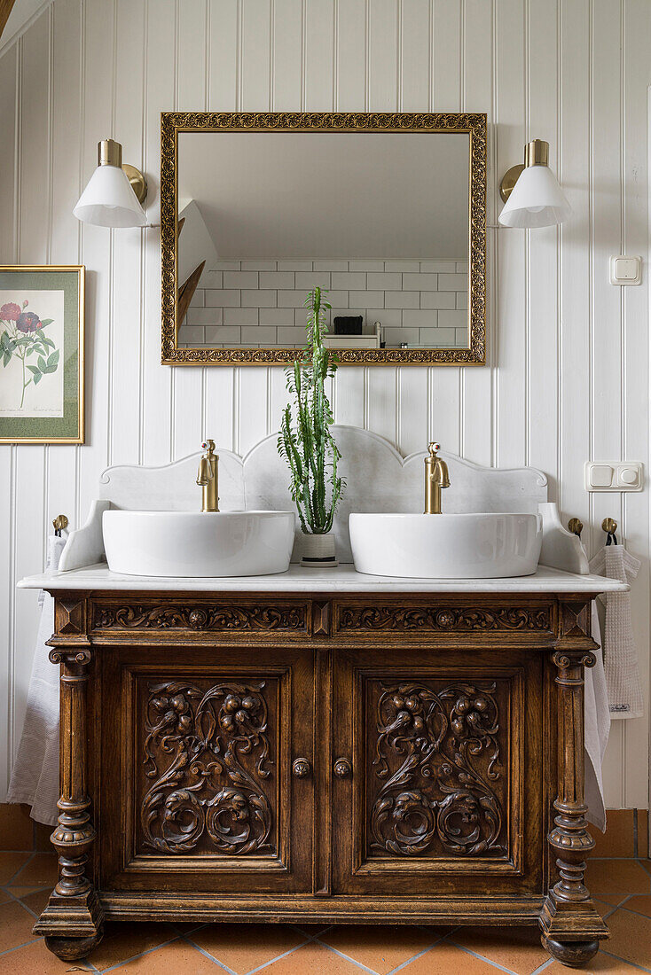 Antique washstand with twin countertop basins in the bathroom