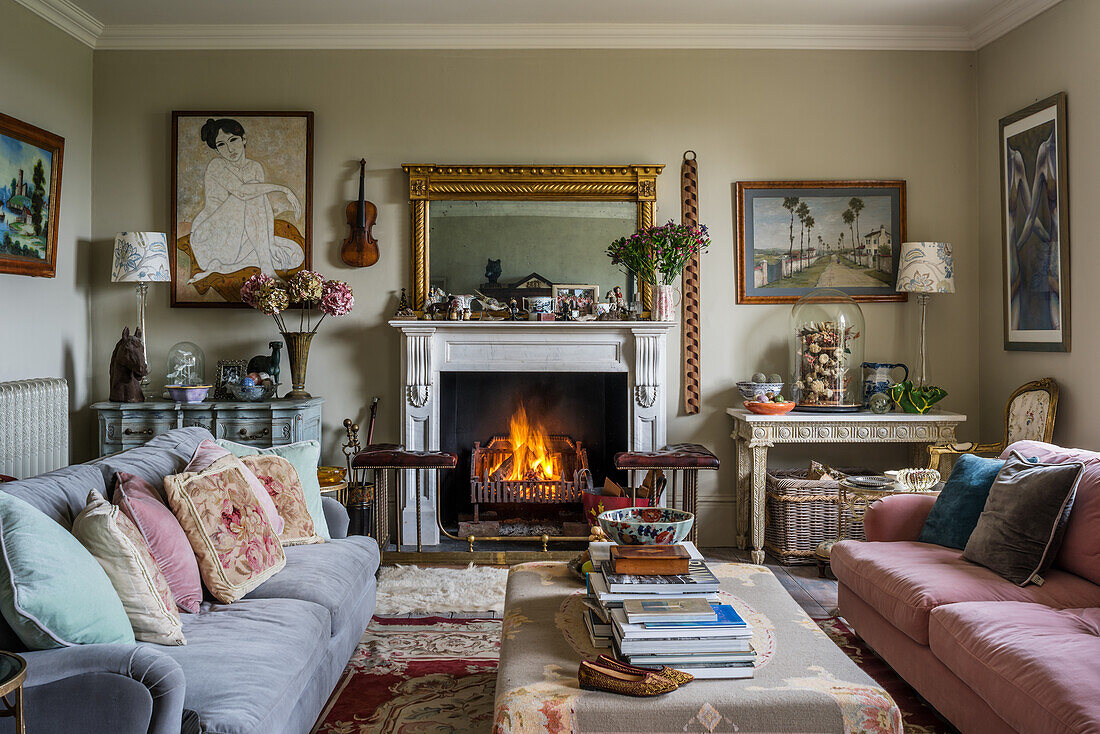 Classic living room with burning fire in open fireplace