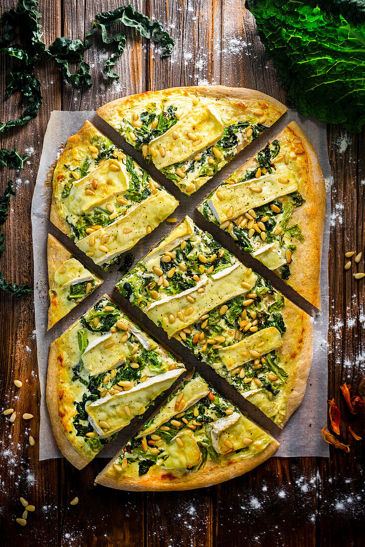 Cabbage and camembert pizza with pine nuts