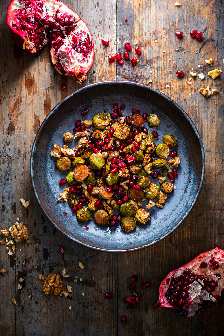 Brussels sprout salad with pomegranate seeds and walnuts