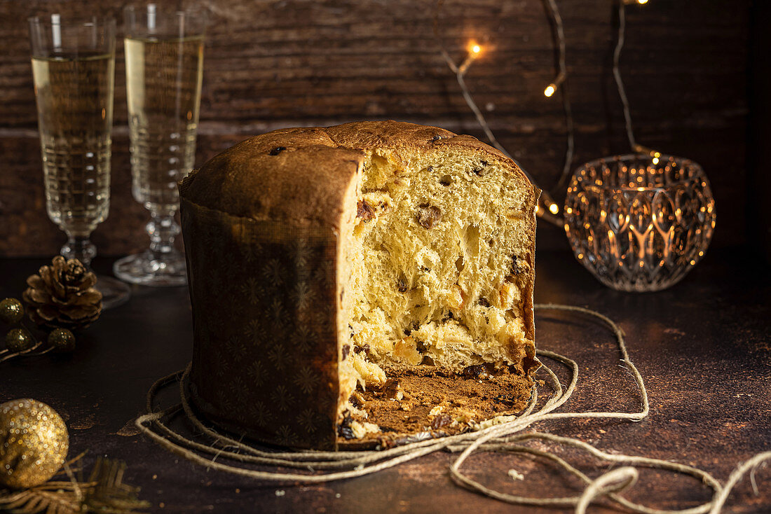 Sliced Panettone - Italian Christmas Dessert with Wine Glasses