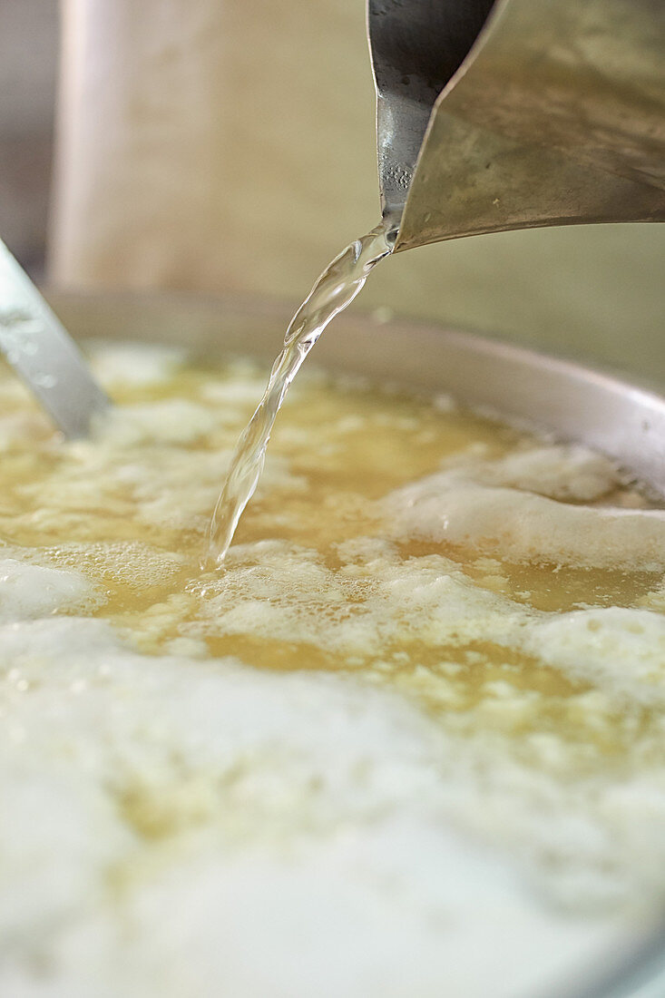 Tofu making: adding coagulant to soy mash