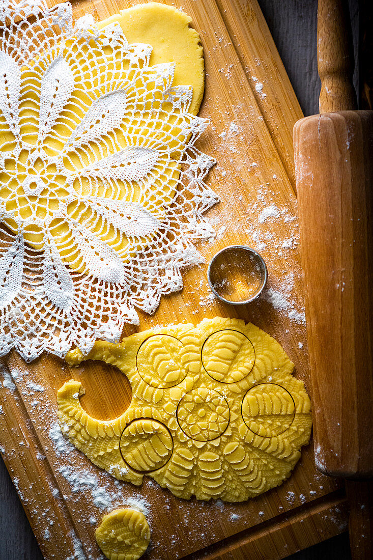 Making lemon biscuits with a lace doily