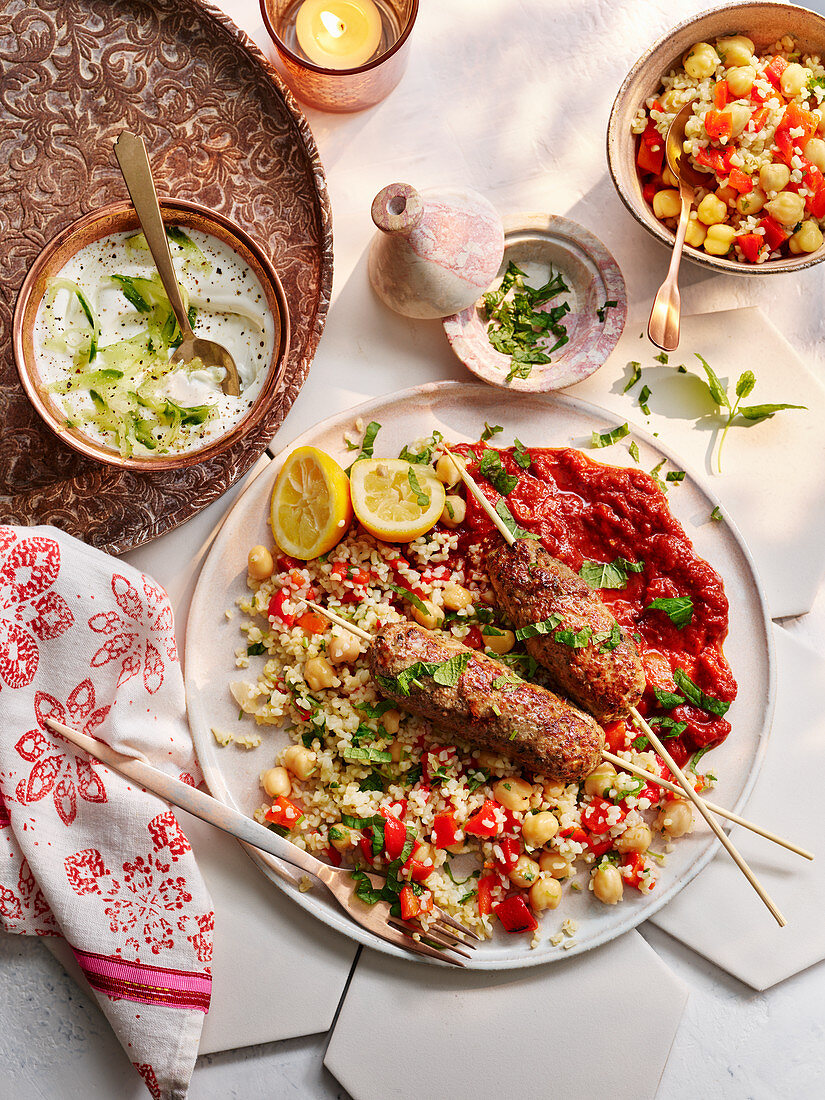 Moroccan kefte with spicy tomato sauce and couscous