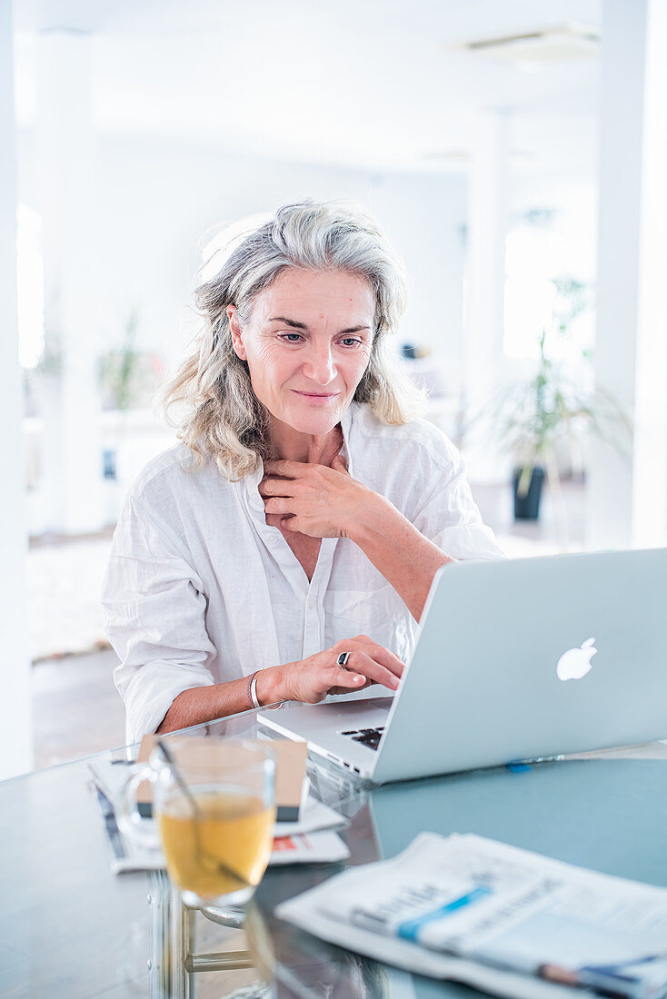 Senior woman using computer