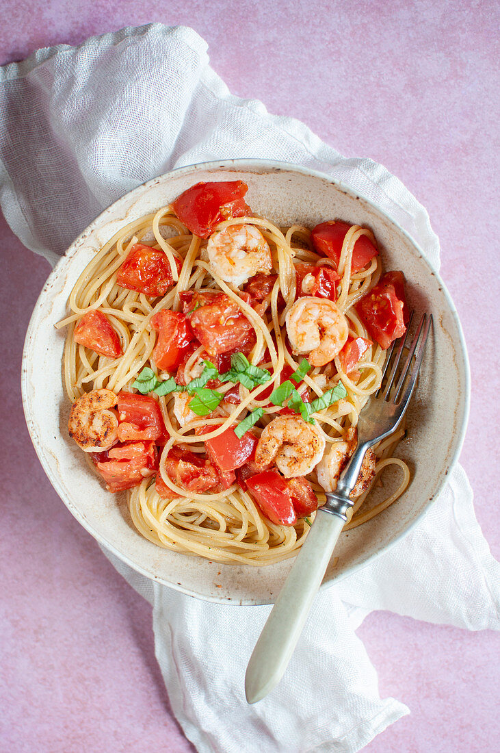 Spaghetti with tomatoes and shrimps