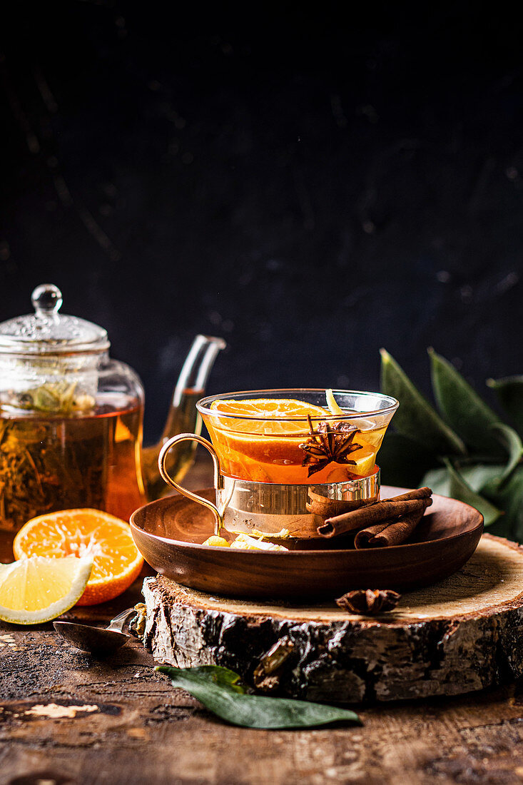 Warming tea with orange and lemon spices and honey