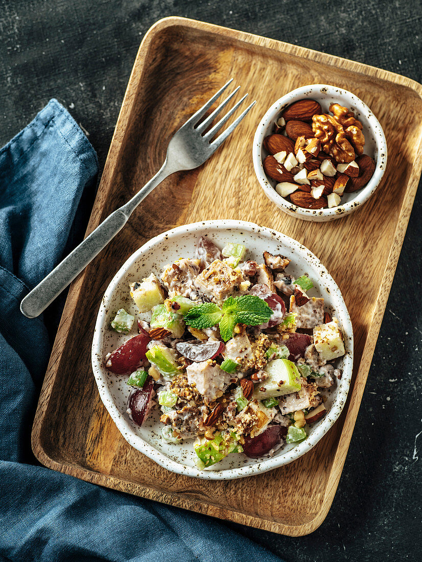 Waldorf salad on wooden tray