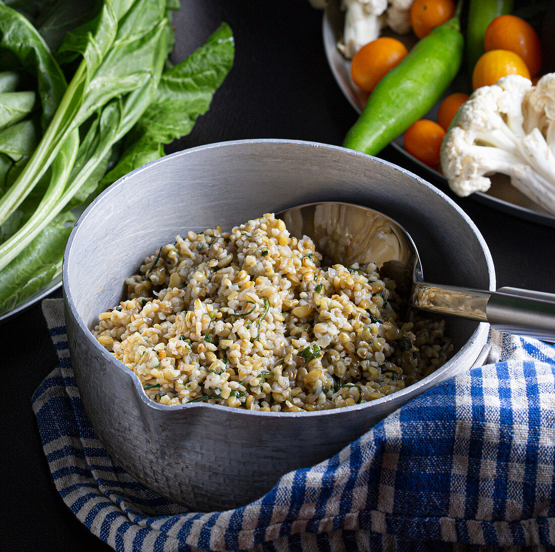 Levantine cuisine: Freekeh (cooked green young wheat) with spinach and garlic