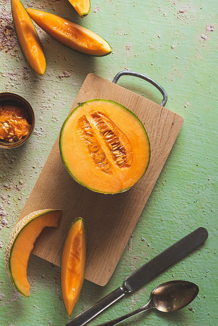 Melon slices on a cutting board